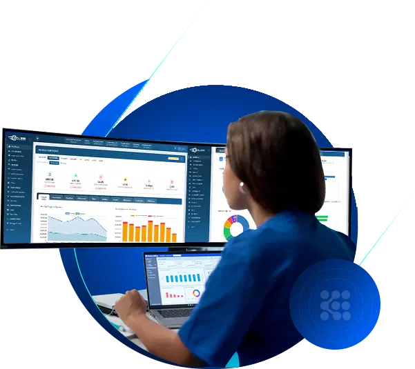 Analyst reviewing Clinical Speed contract analytics on multiple monitors